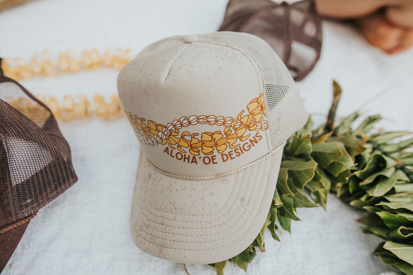 Puakenikeni & Crown Flower Lei Trucker Hat